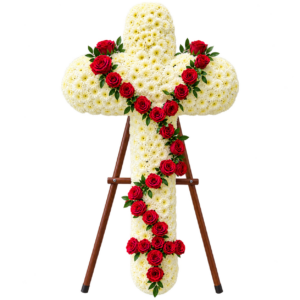 Corona funebre rosario de flores blancas con rosas rojas, presentada sobre soporte de madera para homenaje y condolencias.